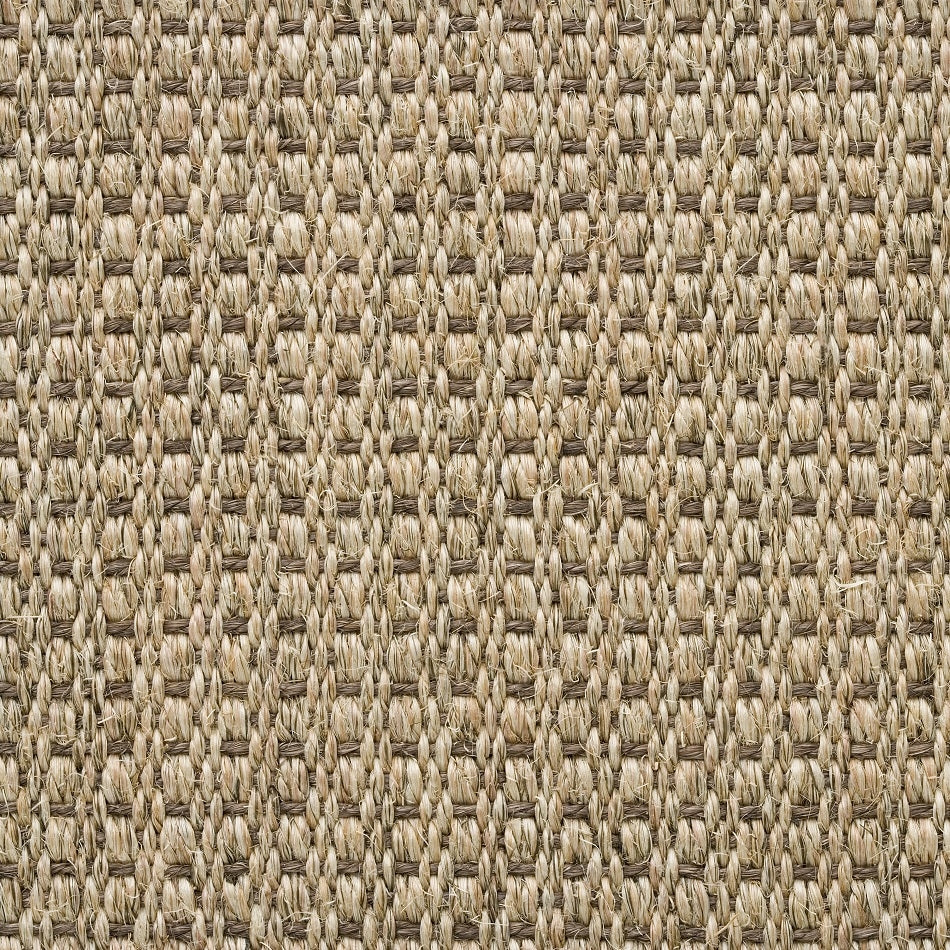 Woven beige sisal flooring with a fine, organic texture, highlighting its natural fibres and artisanal craftsmanship.