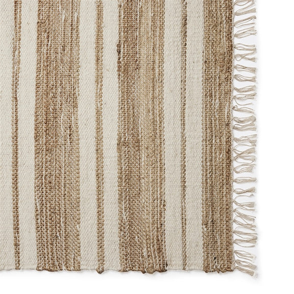 Beige and brown striped runner with a subtle right-edge fringe, crafted in natural fibres and styled on coastal-inspired flooring.