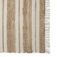 Beige and brown striped runner with a subtle right-edge fringe, crafted in natural fibres and styled on coastal-inspired flooring.