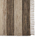 A refined runner with bold brown, beige and black stripes enhances a contemporary living space with natural, enduring elegance.