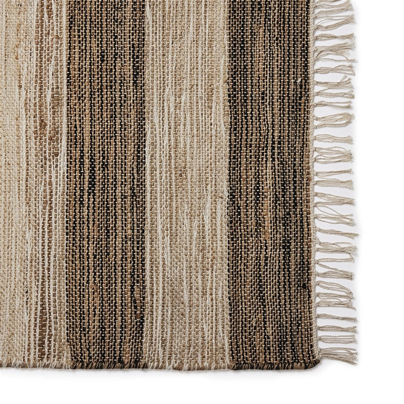A refined runner with bold brown, beige and black stripes enhances a contemporary living space with natural, enduring elegance.