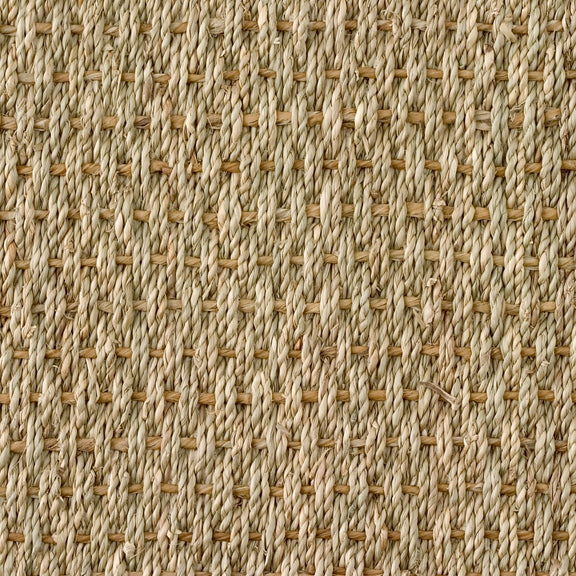 Basketweave seagrass mat in beige and tan, showcasing refined craftsmanship and a durable, textured crisscross weave.