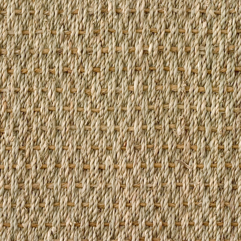 Basketweave seagrass mat in beige and tan, showcasing refined craftsmanship and a durable, textured crisscross weave.