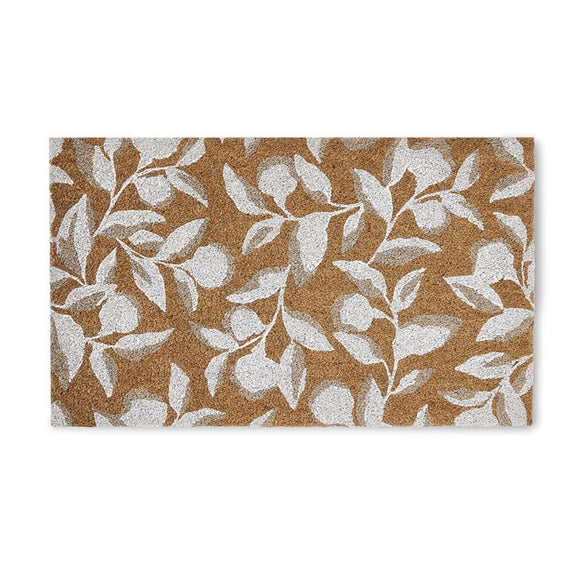 Elegant doormat in natural brown with a crisp white leafy branch motif, displayed on timber flooring in a curated entryway.