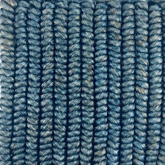 Vertically aligned, textured abaca strands in rich Bristol Blue showcase fine braid weave and artisanal craftsmanship.