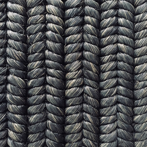 Detailed view of custom-dyed abaca in a dark, braid weave pattern; tightly woven cords highlight artisanal craftsmanship.