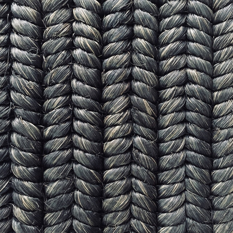 Detailed view of custom-dyed abaca in a dark, braid weave pattern; tightly woven cords highlight artisanal craftsmanship.