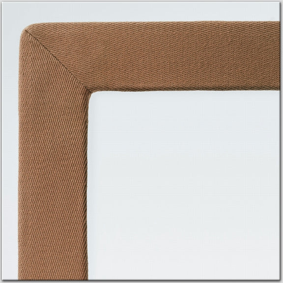 Detailed view of a finely woven cotton and linen rug border, highlighting natural texture against a soft neutral backdrop.