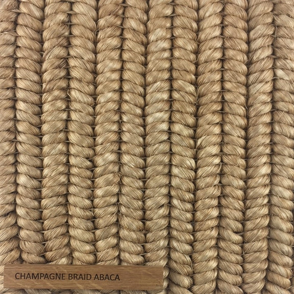 Tightly woven, lustrous light tan abaca fibers form an elegant, durable braid with a refined, natural finish.