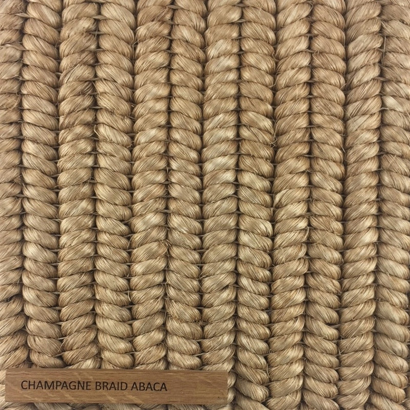 Tightly woven, lustrous light tan abaca fibers form an elegant, durable braid with a refined, natural finish.