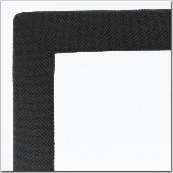 Black, textured cotton and linen rug border detail set against a crisp white background, highlighting premium natural fibres.