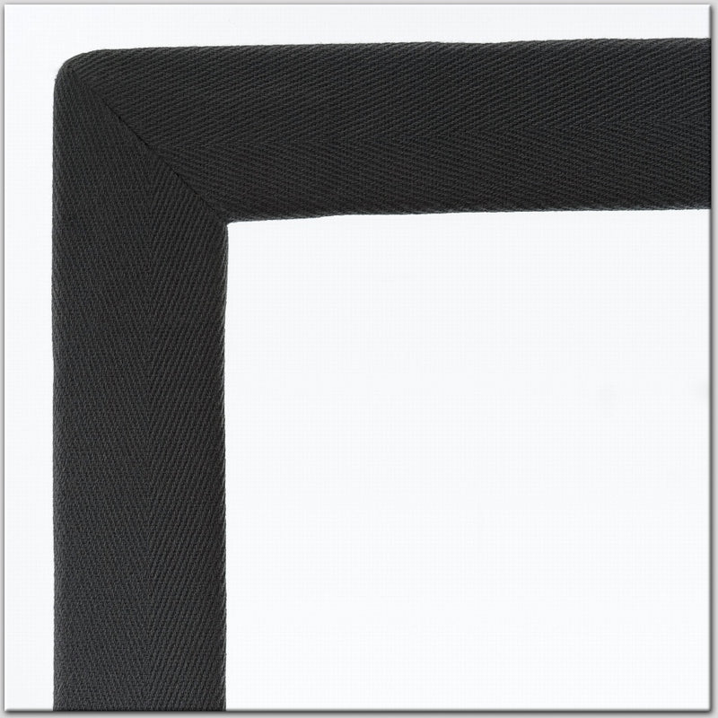 Black, textured cotton and linen rug border detail set against a crisp white background, highlighting premium natural fibres.