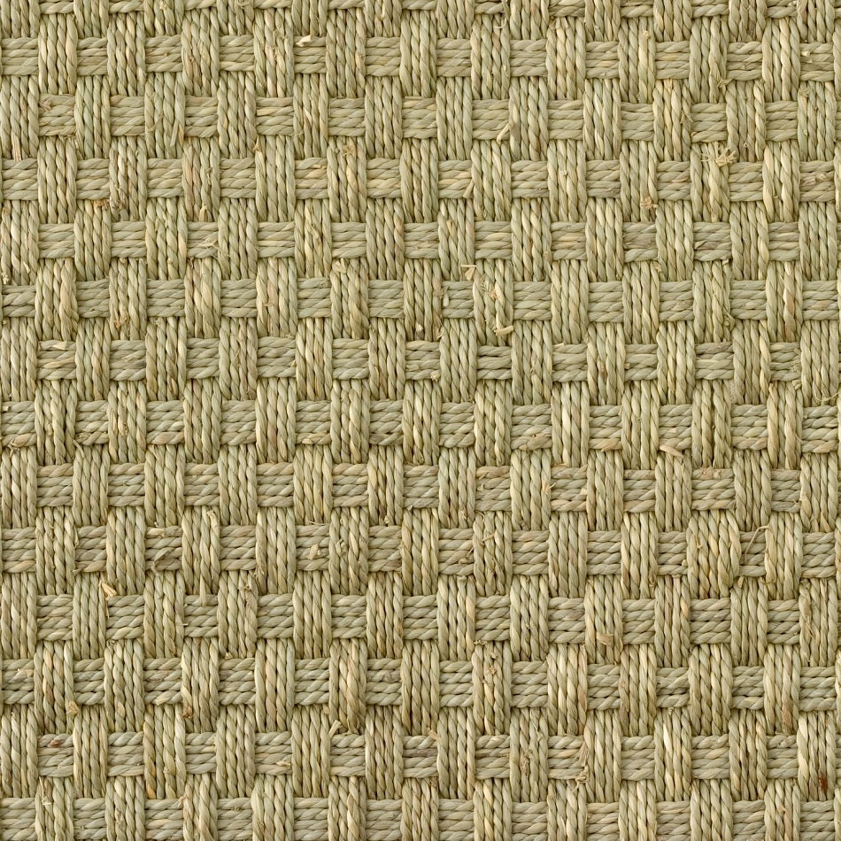 Detailed view of a natural beige square basketweave seagrass mat, highlighting its refined texture and expert craftsmanship.