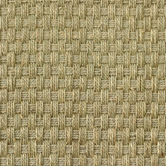Detailed view of a natural beige square basketweave seagrass mat, highlighting its refined texture and expert craftsmanship.
