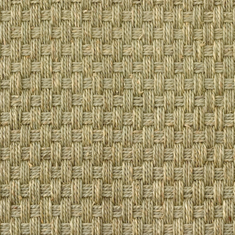 Detailed view of a natural beige square basketweave seagrass mat, highlighting its refined texture and expert craftsmanship.