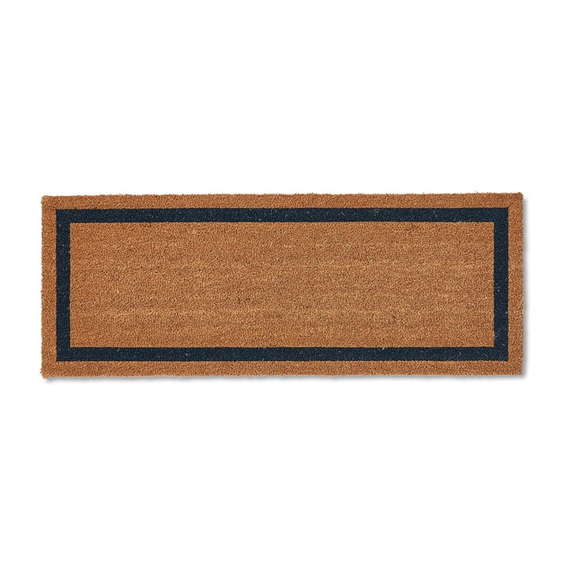 Rectangular brown coir doormat with a refined navy border, showcasing natural texture and quality craftsmanship on a smooth floor.