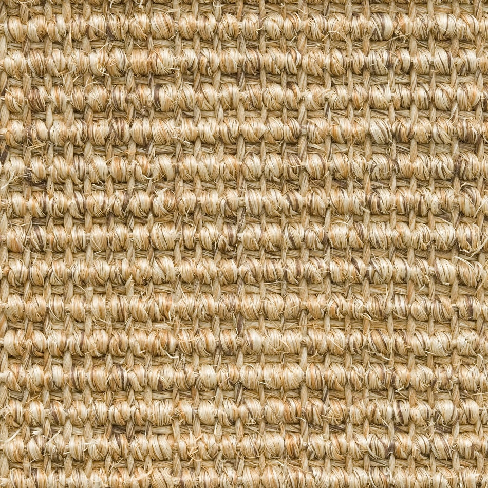 Tightly woven beige sisal flooring with fine ribbed texture, showcasing quality natural fibres and refined craftsmanship.