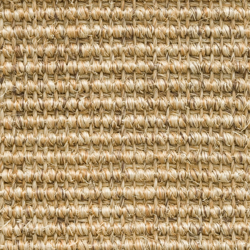 Tightly woven beige sisal flooring with fine ribbed texture, showcasing quality natural fibres and refined craftsmanship.