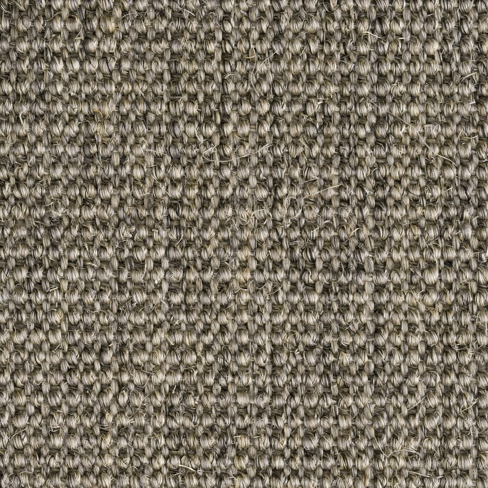 Tightly looped, fine ribbed sisal fibres form a refined grid pattern, showcasing quality craftsmanship and natural durability.