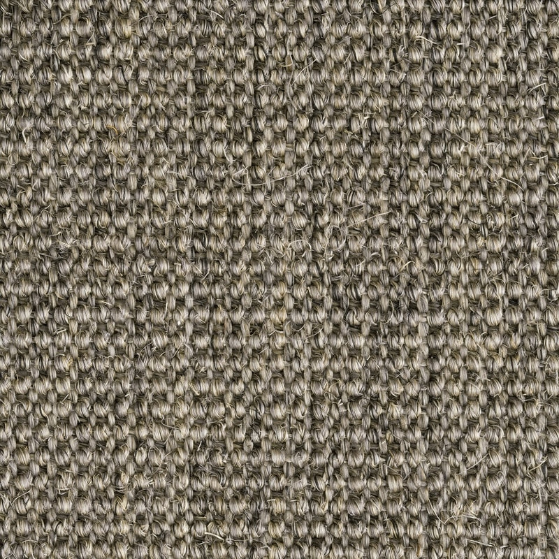Tightly looped, fine ribbed sisal fibres form a refined grid pattern, showcasing quality craftsmanship and natural durability.
