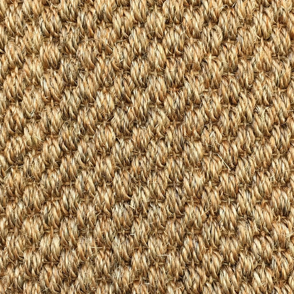 Braided sisal flooring in soft tan and beige, showcasing refined natural texture and artisanal craftsmanship.