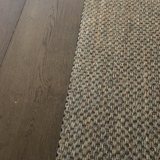 Fine Rustic Slate sisal flooring seamlessly installed beside rich dark timber, highlighting quality, texture and refined design.