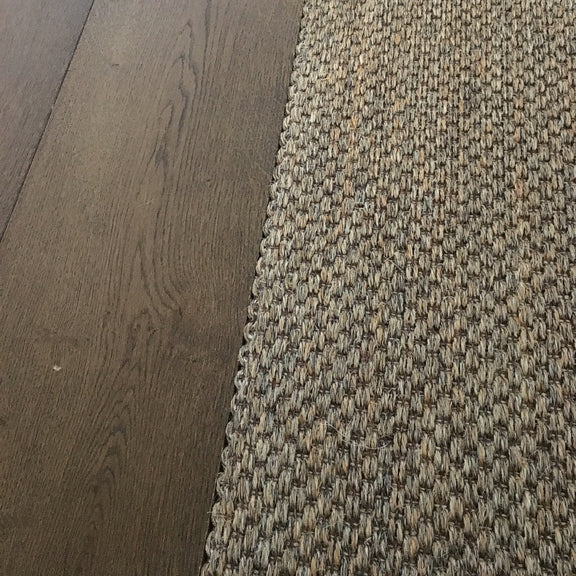Fine Rustic Slate sisal flooring seamlessly installed beside rich dark timber, highlighting quality, texture and refined design.