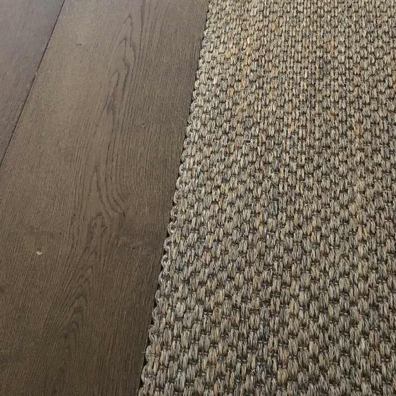 Fine Rustic Slate sisal flooring seamlessly installed beside rich dark timber, highlighting quality, texture and refined design.