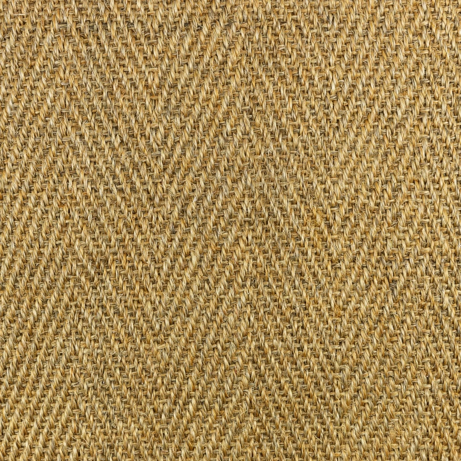 Detailed view of a herringbone sisal rug, showcasing golden-brown natural fibres and refined artisanal texture.