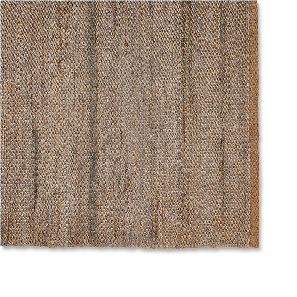 Close-up of a frost grey jute rug in flatweave, highlighting its sturdy border and refined, natural fibre craftsmanship.