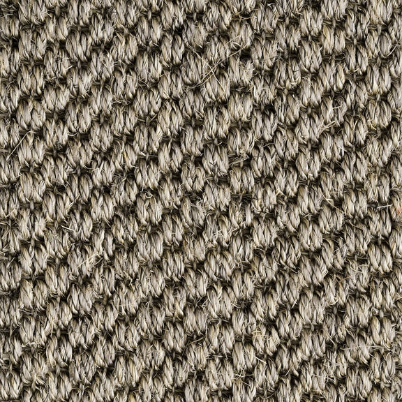 Detailed view of rustic granite sisal carpet, showcasing thick, interwoven natural fibres and crafted texture.