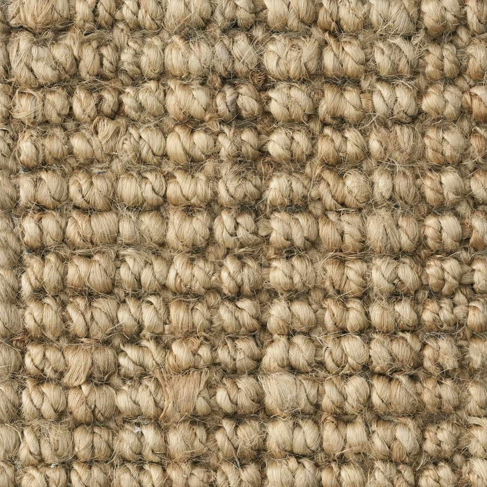 Detailed view of a finely woven, light tan jute floorcovering showcasing its natural texture and artisanal craftsmanship.