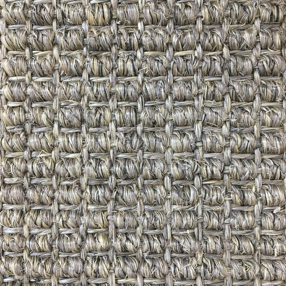 Textured beige and grey sisal rug in a refined basketweave, highlighting natural fibres and detailed craftsmanship.