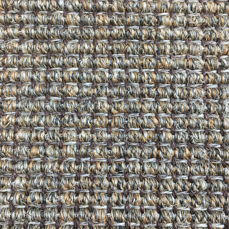 Detailed view of textured sisal flooring in earthy brown, grey and beige tones with a refined, repeating square weave pattern.