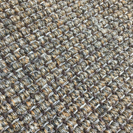 Detailed view of ribbed slate sisal showcasing a refined, grid-like weave in soft, neutral tones and premium natural texture.