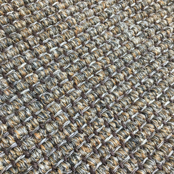 Detailed view of ribbed slate sisal showcasing a refined, grid-like weave in soft, neutral tones and premium natural texture.