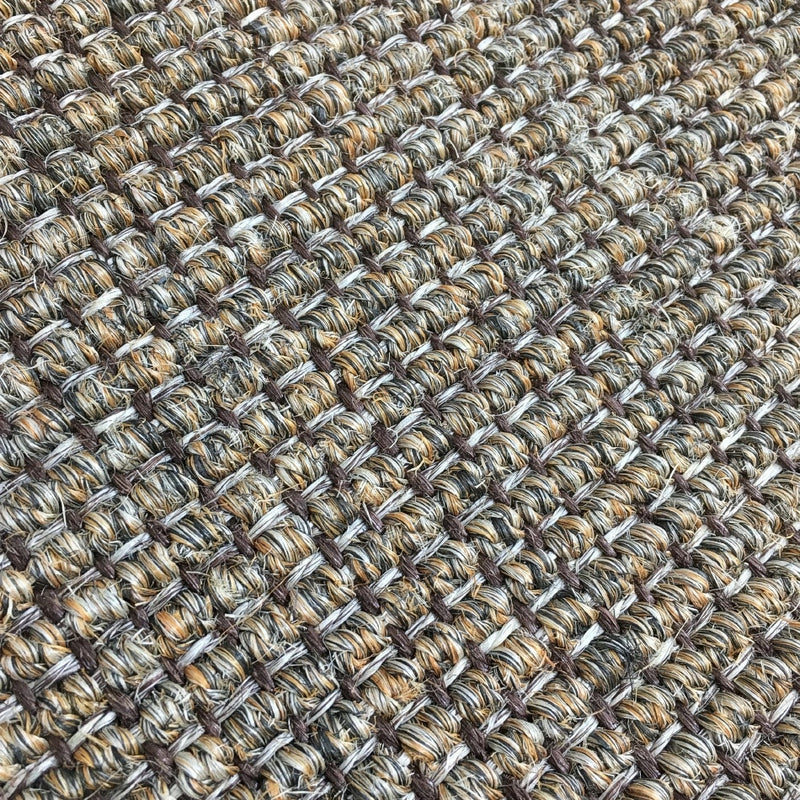 Detailed view of ribbed slate sisal showcasing a refined, grid-like weave in soft, neutral tones and premium natural texture.