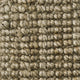 Detail of finely woven light brown jute carpet, highlighting its natural texture and premium artisanal craftsmanship.
