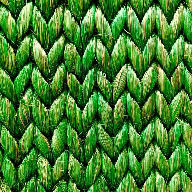 Detailed view of a herringbone pattern in textured green abaca, showcasing its rich weave and sustainable craftsmanship.