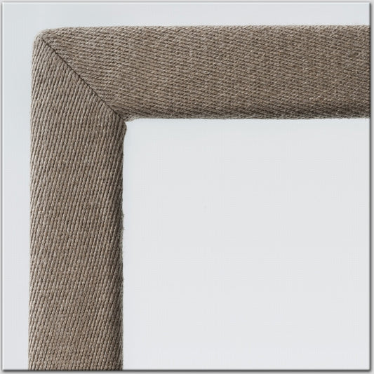 Detailed shot of a cotton and linen border frame crafted from sustainable fabric, set against a crisp white backdrop.