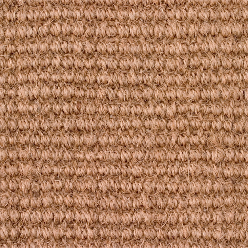 Detailed view of natural coir flooring with ribbed texture, highlighting its rich fibres and refined, sustainable craftsmanship.