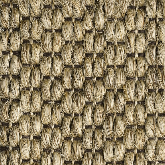 Textured sisal mat in beige and brown, woven in a rich, rustic pattern that highlights artisanal craftsmanship and natural fibres.