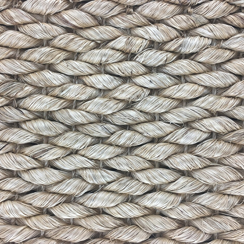 Thick beige natural fibre rope strands woven in an intricate, durable pattern, highlighting artisanal craftsmanship and quality.
