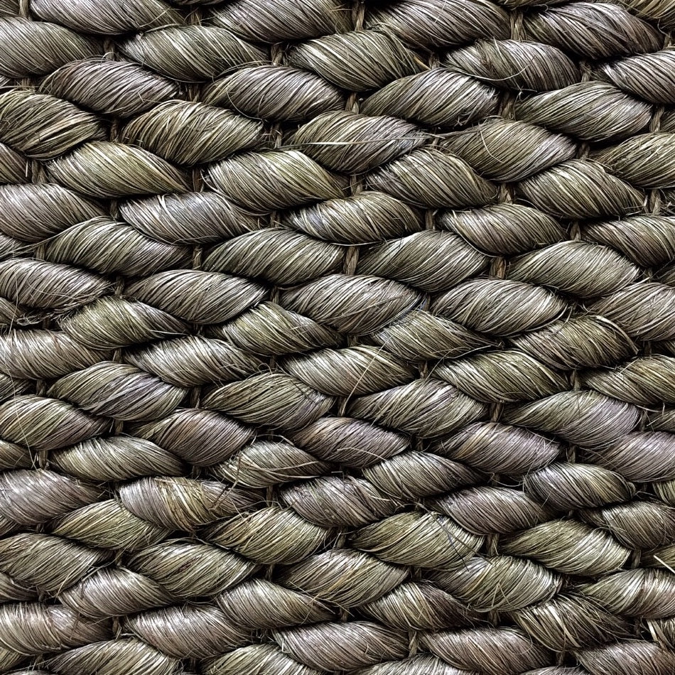 Thick, hand-braided Burnt Olive abaca rope with rich texture and artisanal detail in a sophisticated, natural weave.