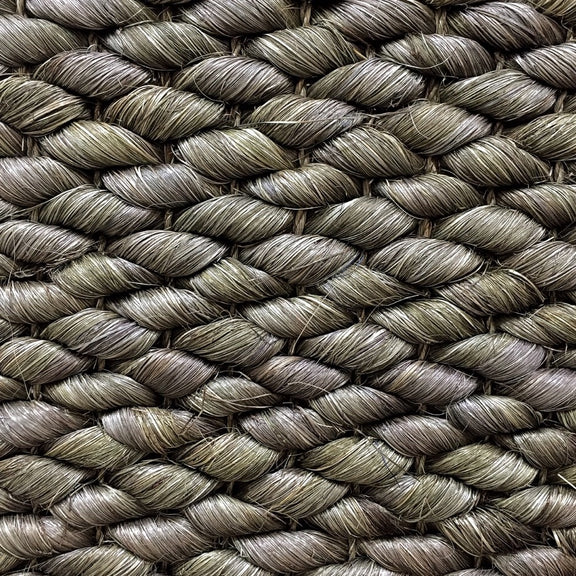 Thick, hand-braided Burnt Olive abaca rope with rich texture and artisanal detail in a sophisticated, natural weave.