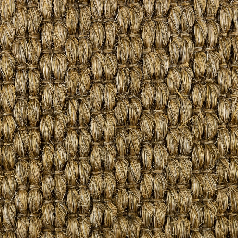 Textured brown sisal rug with a heavy, rustic grid pattern and natural fibers, showcasing quality craftsmanship and durability.
