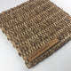 Thick, square-weave abaca rug in a natural tone, showcasing rich texture and sustainable craftsmanship on a contemporary floor.