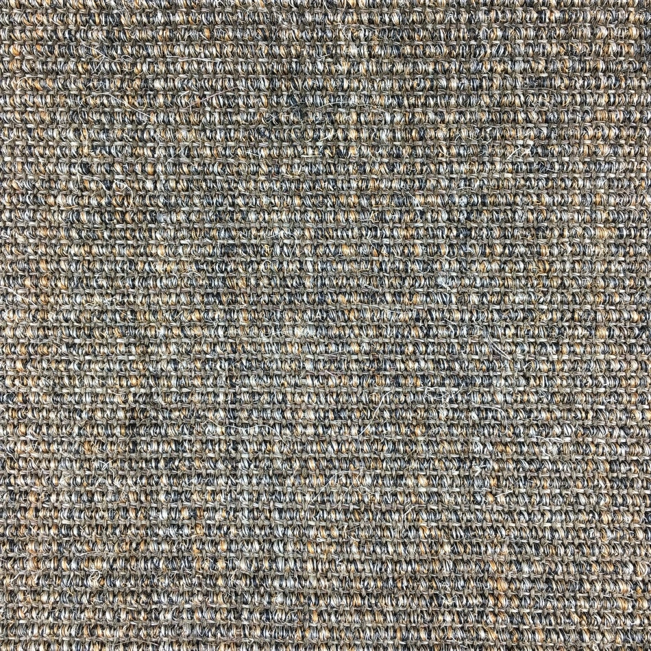 A tightly woven sisal rug in a refined gray and beige ribbed pattern, highlighting its natural texture and craftsmanship.