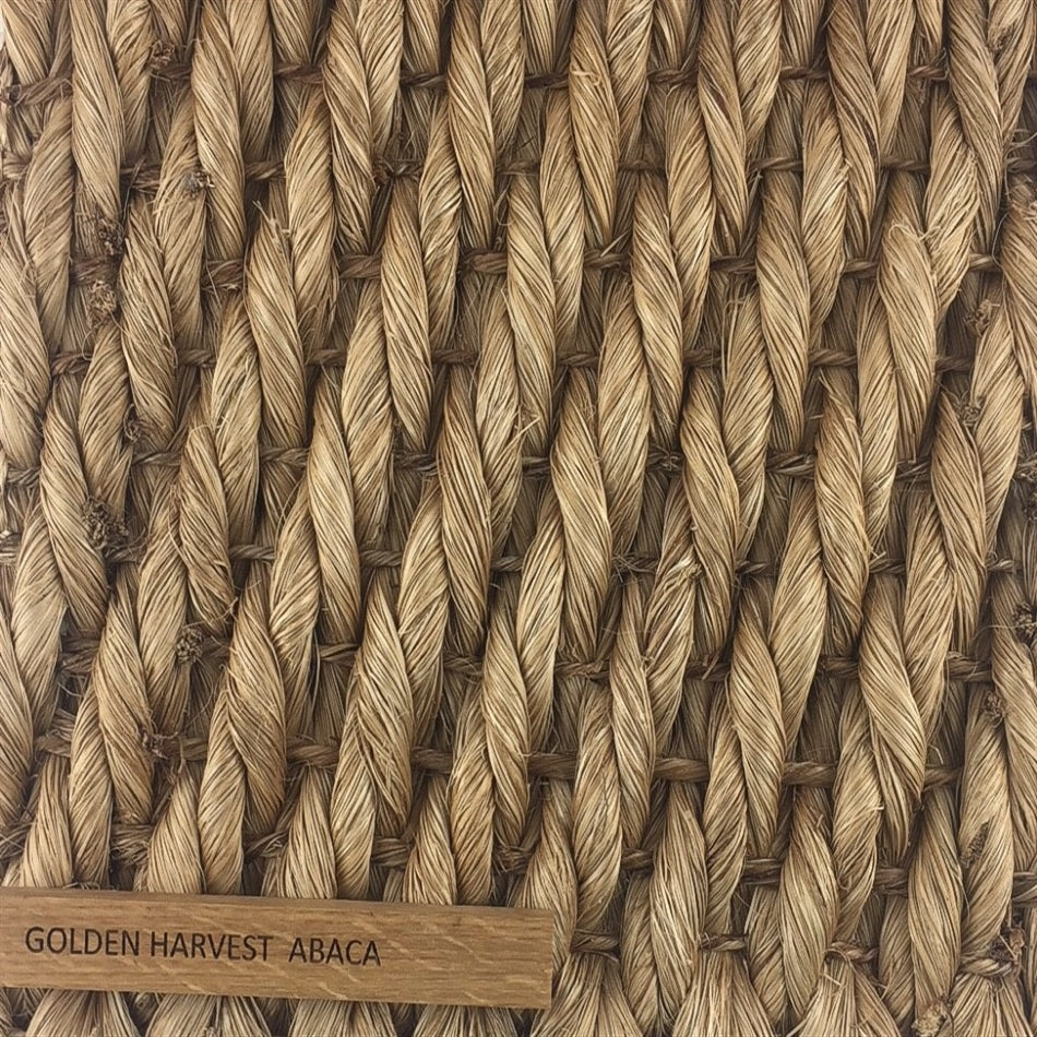 Detailed view of finely woven golden abaca fibres, highlighting natural texture and artisanal craftsmanship.