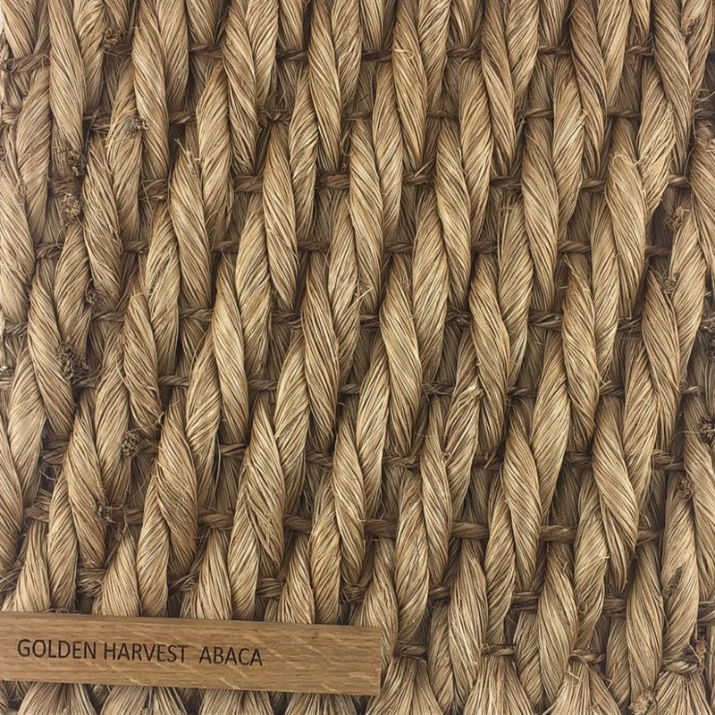 Detailed view of finely woven golden abaca fibres, highlighting natural texture and artisanal craftsmanship.